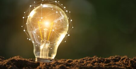 Light bulb glowing in soil as idea or energy concept | Forbes