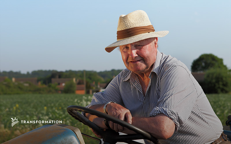 man on tractor at smallholder farm